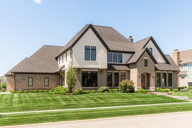5N257 Switchgrass Ln, Saint Charles, IL 60175 - view of front of property featuring brick siding, a front lawn, and a shingled roof