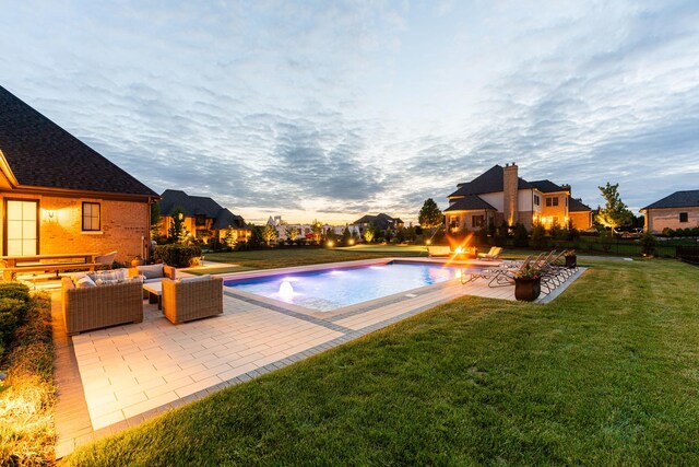 5N257 Switchgrass Ln, Saint Charles, IL 60175 - pool at dusk featuring an outdoor living space, a patio area, and a yard