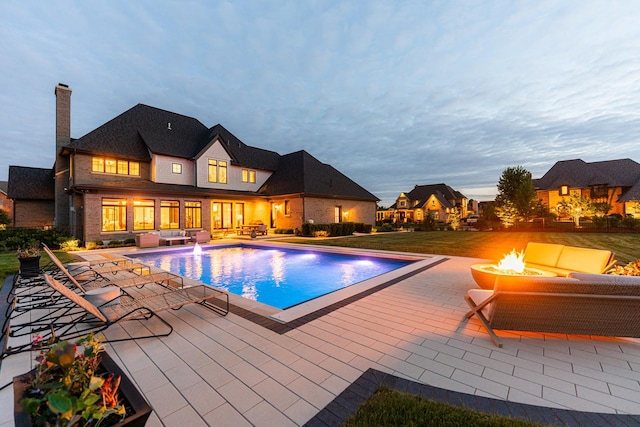 5N257 Switchgrass Ln, Saint Charles, IL 60175 - view of pool featuring an outdoor living space with a fire pit and a patio