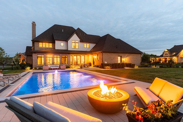 5N257 Switchgrass Ln, Saint Charles, IL 60175 - view of pool with an outdoor living space with a fire pit and a patio