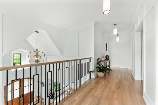 5N257 Switchgrass Ln, Saint Charles, IL 60175 - hallway featuring a chandelier, wood finished floors, and baseboards