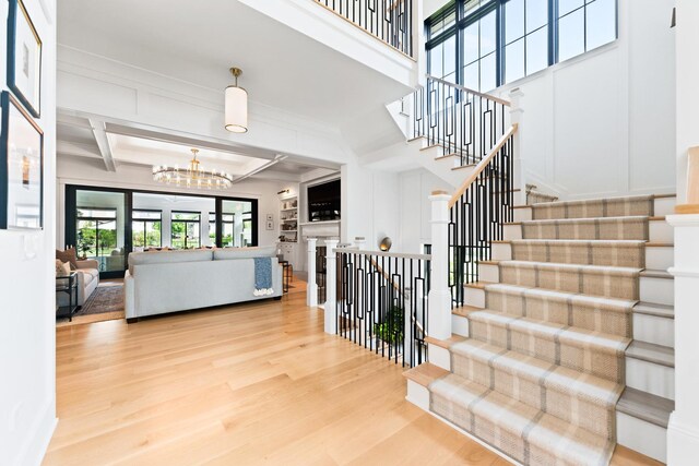 5N257 Switchgrass Ln, Saint Charles, IL 60175 - corridor featuring a chandelier and wood finished floors
