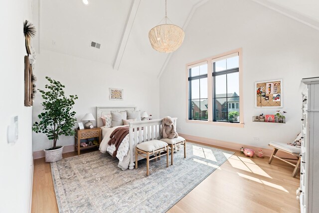 5N257 Switchgrass Ln, Saint Charles, IL 60175 - bedroom featuring high vaulted ceiling, wood finished floors, a chandelier, and beamed ceiling