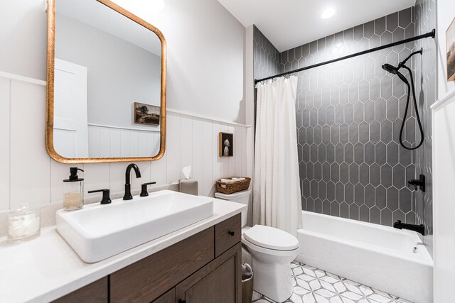 5N257 Switchgrass Ln, Saint Charles, IL 60175 - bathroom featuring vanity, shower / bathtub combination with curtain, and wainscoting