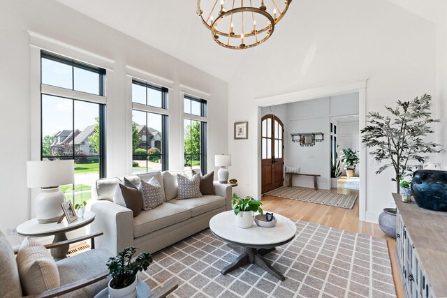 5N257 Switchgrass Ln, Saint Charles, IL 60175 - living room with a chandelier, light wood-type flooring, plenty of natural light, and high vaulted ceiling