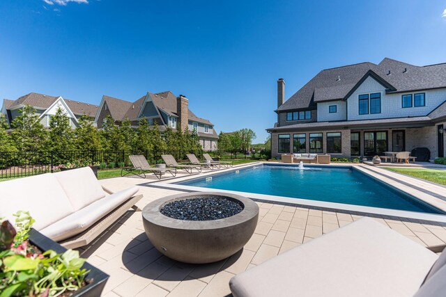 5N257 Switchgrass Ln, Saint Charles, IL 60175 - view of pool featuring a patio area and an outdoor living space with a fire pit