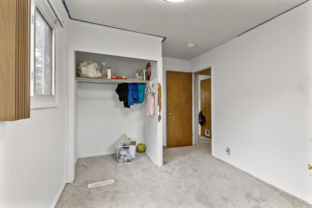 8 Sparrow Rd, Carpentersville, IL 60110 - unfurnished bedroom featuring carpet flooring, a closet, and baseboards