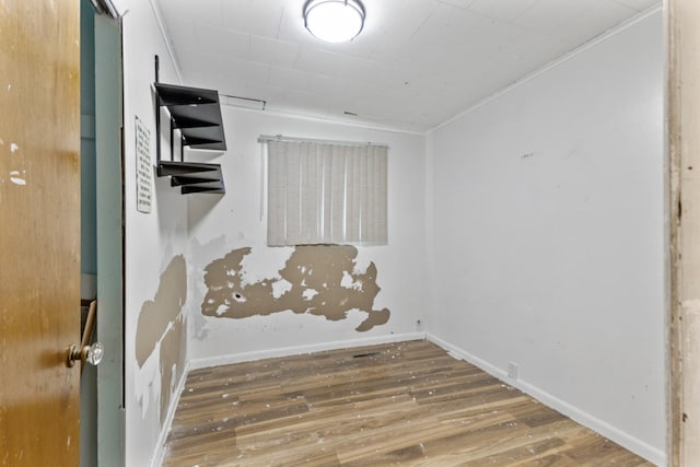 8 Sparrow Rd, Carpentersville, IL 60110 - spare room featuring wood finished floors, ornamental molding, and baseboards
