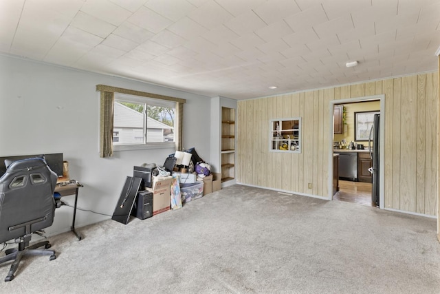 8 Sparrow Rd, Carpentersville, IL 60110 - carpeted office space featuring wood walls, baseboards, and built in shelves