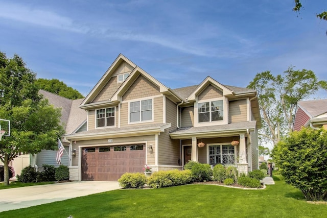 212 S Wa Pella Ave, Mount Prospect, IL 60056 - craftsman house featuring concrete driveway, a garage, and a front yard