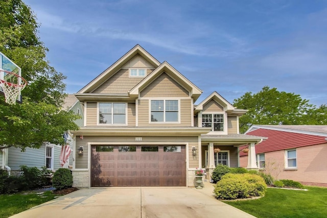 212 S Wa Pella Ave, Mount Prospect, IL 60056 - craftsman inspired home with a garage, driveway, stone siding, and a front lawn