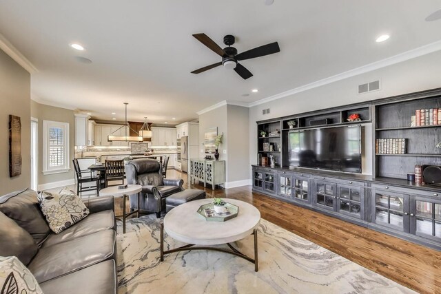 212 S Wa Pella Ave, Mount Prospect, IL 60056 - living room featuring ceiling fan, baseboards, ornamental molding, recessed lighting, and wood finished floors