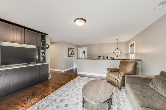 212 S Wa Pella Ave, Mount Prospect, IL 60056 - living room with dark wood finished floors, a chandelier, and baseboards