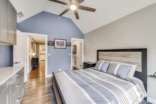 212 S Wa Pella Ave, Mount Prospect, IL 60056 - bedroom with high vaulted ceiling, light wood-style flooring, baseboards, and a ceiling fan