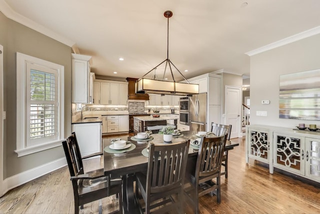 212 S Wa Pella Ave, Mount Prospect, IL 60056 - dining area featuring light wood-type flooring, ornamental molding, baseboards, and recessed lighting
