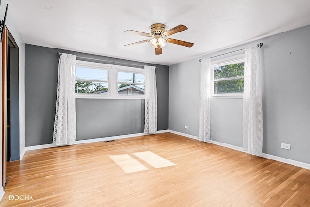 9446 Magnolia Ave, Mokena, IL 60448 - unfurnished room featuring wood finished floors and a ceiling fan