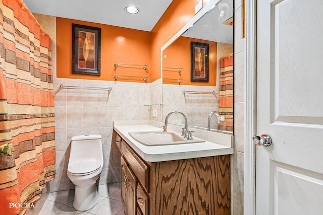 9446 Magnolia Ave, Mokena, IL 60448 - bathroom featuring vanity, tile patterned floors, tile walls, and a wainscoted wall
