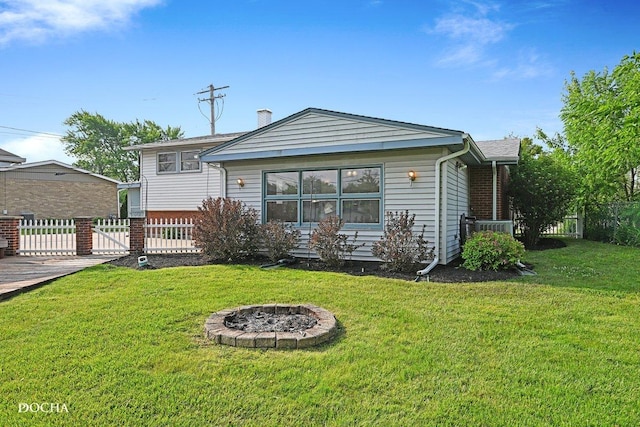 9446 Magnolia Ave, Mokena, IL 60448 - rear view of house featuring a fire pit, a chimney, and brick siding