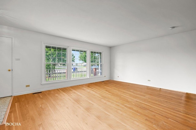 9446 Magnolia Ave, Mokena, IL 60448 - unfurnished room featuring light wood-style flooring and a smoke detector