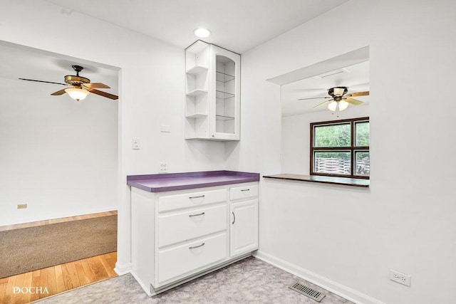 9446 Magnolia Ave, Mokena, IL 60448 - kitchen with ceiling fan, dark countertops, white cabinetry, glass insert cabinets, and open shelves