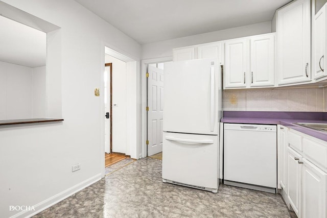9446 Magnolia Ave, Mokena, IL 60448 - kitchen with white appliances, white cabinets, and dark countertops