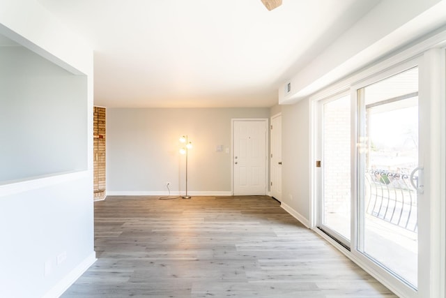 6154 W 63rd St Unit 3W, Chicago, IL 60638 - unfurnished room featuring light wood finished floors and baseboards