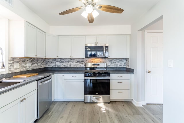 6154 W 63rd St Unit 3W, Chicago, IL 60638 - kitchen with stainless steel appliances, a sink, light wood finished floors, and backsplash