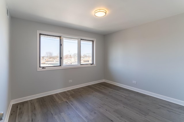 6154 W 63rd St Unit 3W, Chicago, IL 60638 - empty room with dark wood-style floors and baseboards