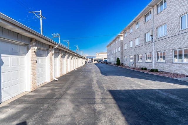 6154 W 63rd St Unit 3W, Chicago, IL 60638 - view of asphalt road featuring community garages
