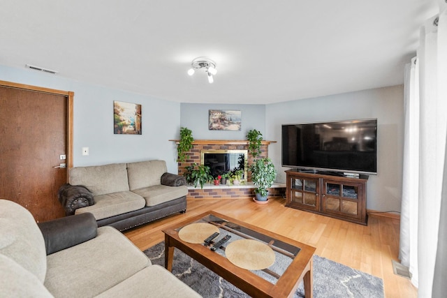 1018 Brighton Ct, Schaumburg, IL 60193 - living room featuring wood finished floors and a fireplace