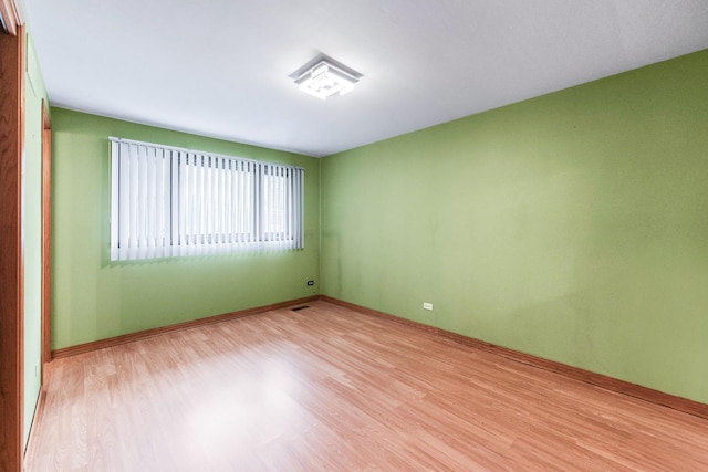 1018 Brighton Ct, Schaumburg, IL 60193 - unfurnished room featuring light wood-style flooring and baseboards