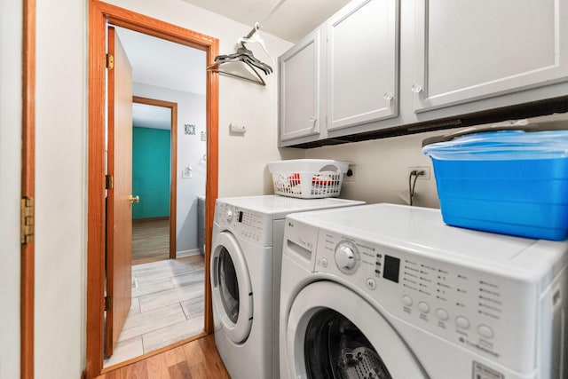 1018 Brighton Ct, Schaumburg, IL 60193 - laundry room featuring cabinet space, washer and dryer, light wood-type flooring, and baseboards