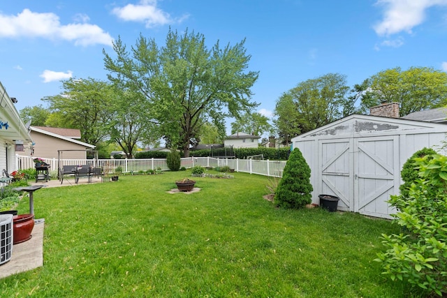 1018 Brighton Ct, Schaumburg, IL 60193 - view of yard featuring an outdoor fire pit and central AC unit