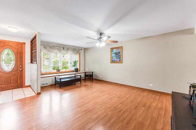 1018 Brighton Ct, Schaumburg, IL 60193 - foyer entrance with a ceiling fan, light wood-style floors, and baseboards