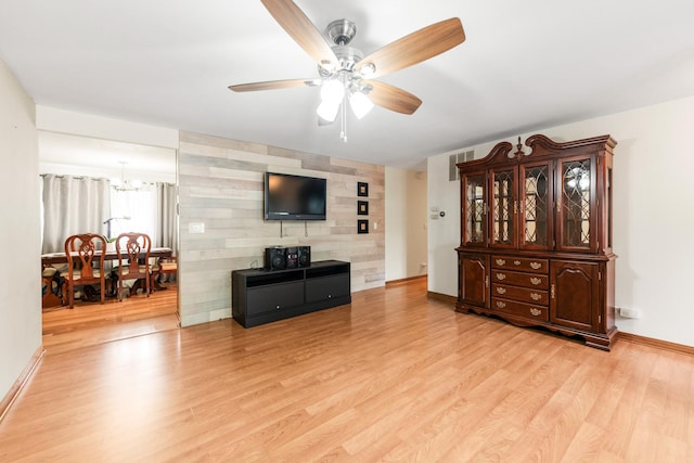 1018 Brighton Ct, Schaumburg, IL 60193 - living room with a ceiling fan, light wood-style floors, a chandelier, and baseboards