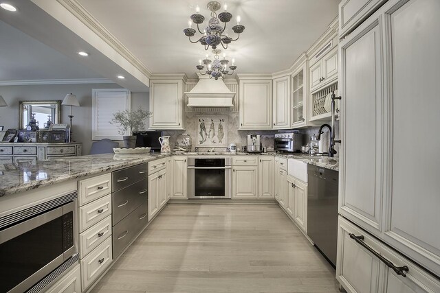 1212 N Lake Shore Dr Unit 21As, Chicago, IL 60610 - kitchen featuring appliances with stainless steel finishes, ornamental molding, light stone countertops, recessed lighting, and backsplash