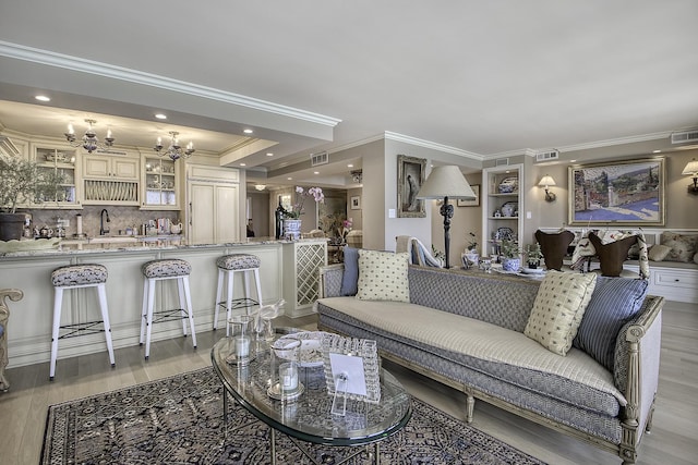 1212 N Lake Shore Dr Unit 21As, Chicago, IL 60610 - living area featuring light wood-style floors, a chandelier, ornamental molding, and recessed lighting