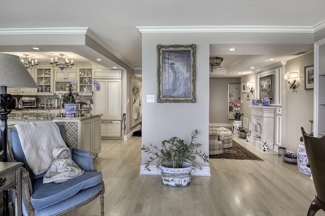 1212 N Lake Shore Dr Unit 21As, Chicago, IL 60610 - living area with a chandelier, light wood finished floors, recessed lighting, and ornamental molding
