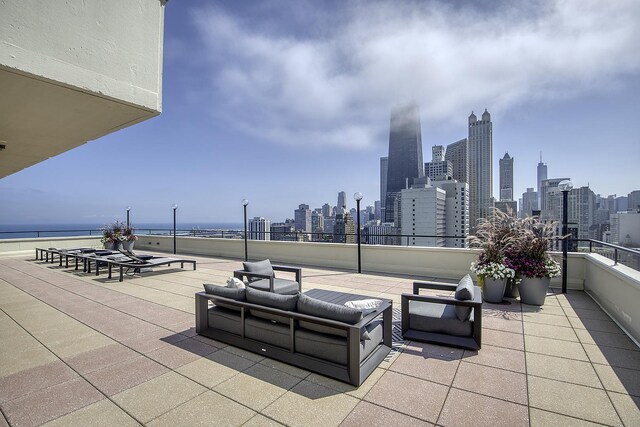 1212 N Lake Shore Dr Unit 21As, Chicago, IL 60610 - view of patio with a skyline view, an outdoor living space, and a water view