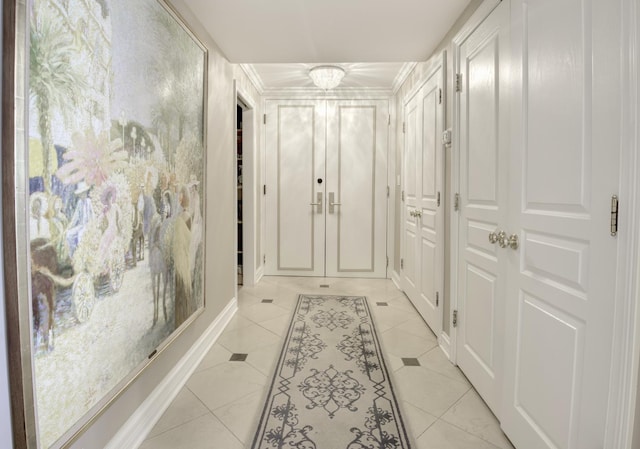 1212 N Lake Shore Dr Unit 21As, Chicago, IL 60610 - corridor with light tile patterned floors and a chandelier
