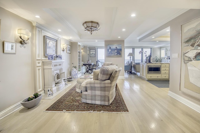 1212 N Lake Shore Dr Unit 21As, Chicago, IL 60610 - living room featuring ornamental molding, healthy amount of natural light, light wood-type flooring, baseboards, and a tray ceiling