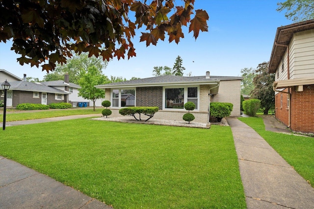 421 Carey Ct, Chicago Heights, IL 60411 - view of front of house with brick siding and a front lawn