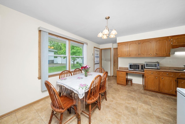 421 Carey Ct, Chicago Heights, IL 60411 - dining room featuring a chandelier and baseboards