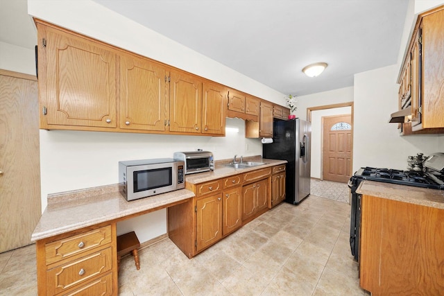 421 Carey Ct, Chicago Heights, IL 60411 - kitchen with stainless steel appliances, a sink, under cabinet range hood, and light countertops