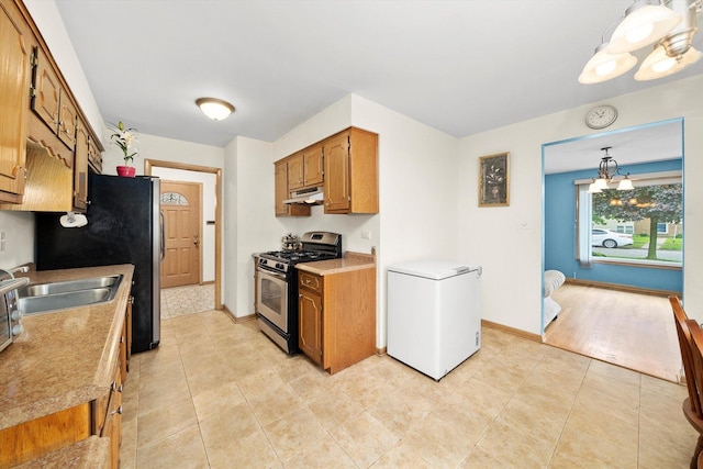421 Carey Ct, Chicago Heights, IL 60411 - kitchen with stainless steel appliances, under cabinet range hood, a sink, and brown cabinets