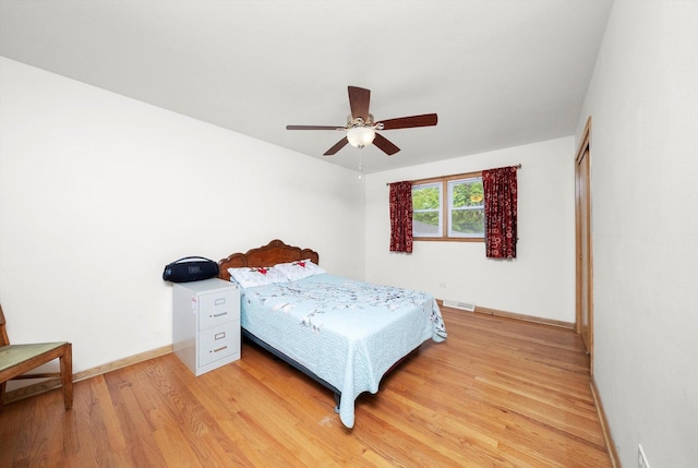 421 Carey Ct, Chicago Heights, IL 60411 - bedroom with light wood finished floors, baseboards, and a ceiling fan