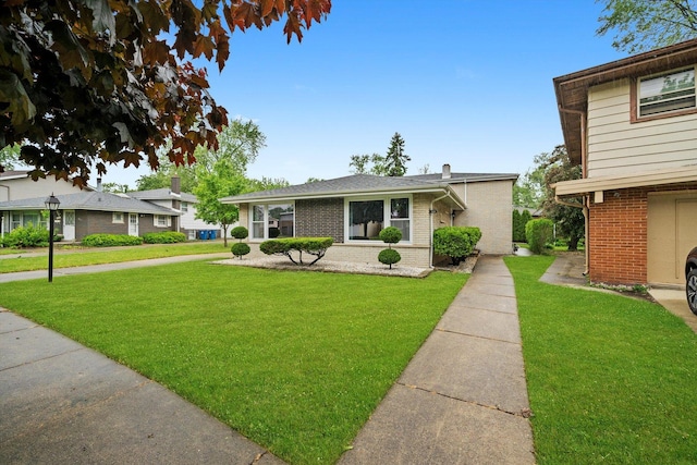 421 Carey Ct, Chicago Heights, IL 60411 - view of front of house with brick siding and a front lawn