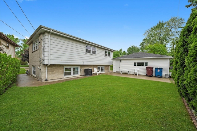 421 Carey Ct, Chicago Heights, IL 60411 - back of property with a patio area and a yard