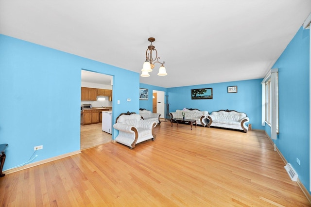 421 Carey Ct, Chicago Heights, IL 60411 - bedroom with a chandelier and light wood-type flooring