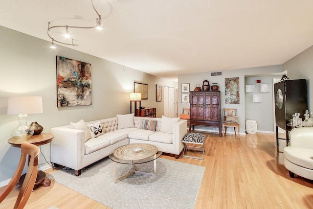 1580 Sherman Ave Unit 1006, Evanston, IL 60201 - living room with light wood-style floors and baseboards